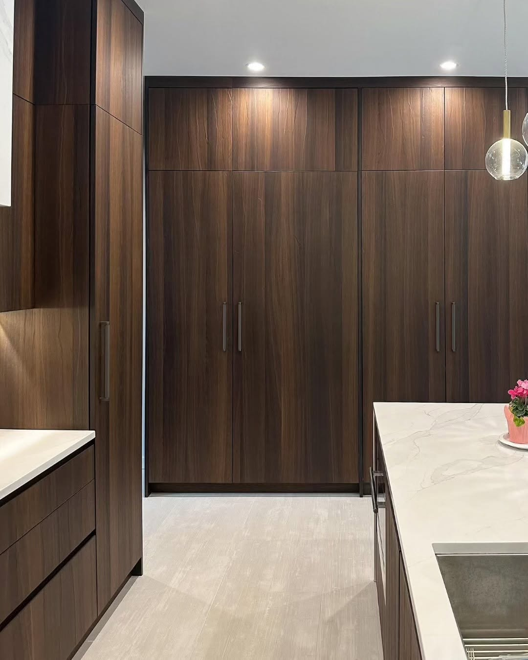 Floor to ceiling walnut pantry cabinetry